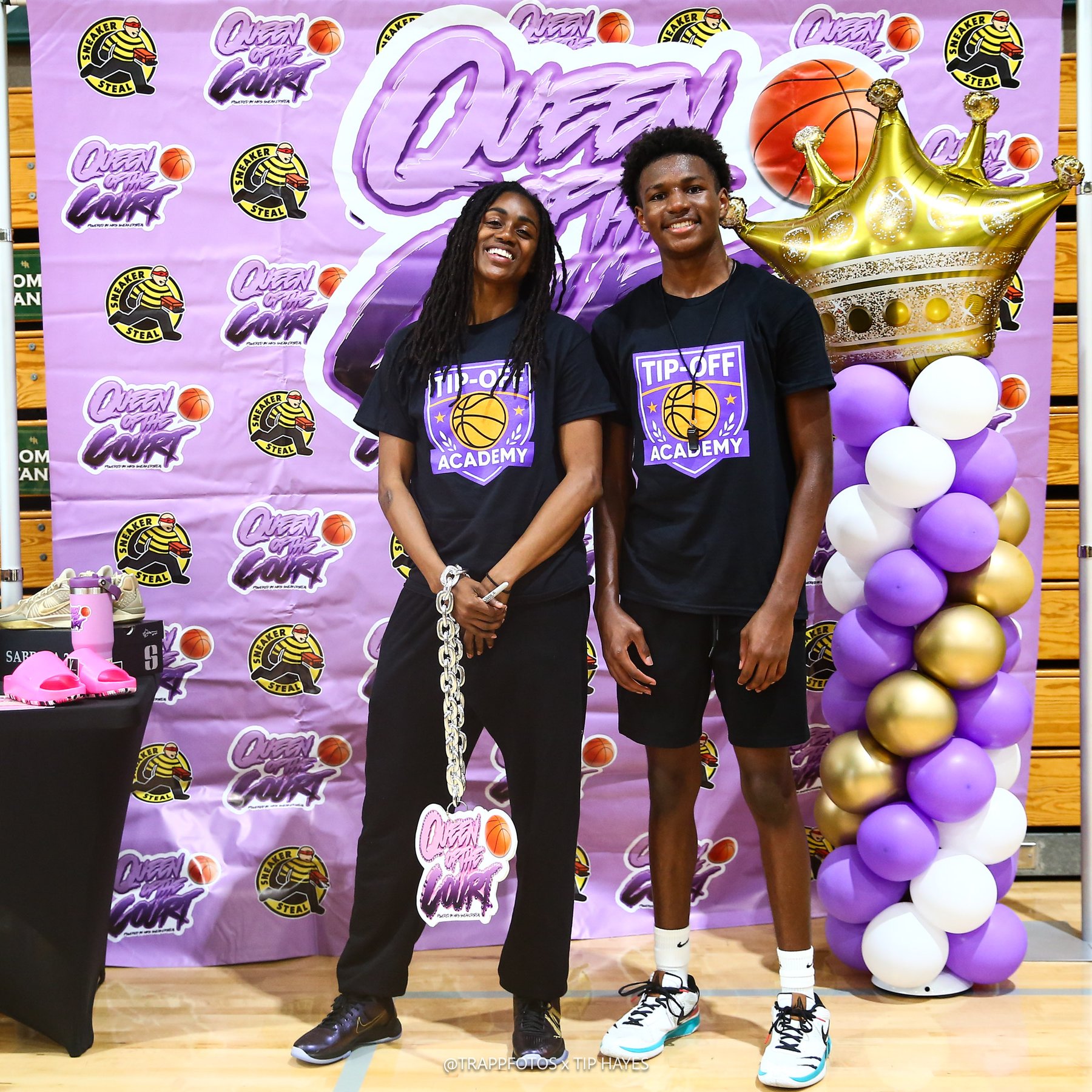 Tiffany Hayes and a Tip-Off Academy camper at the Queen of the Court backdrop